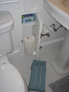 After installing a pedestal sink in our hall bath, we lost some storage space...but my husband found a little pocket in the wall to hold our toilet paper.